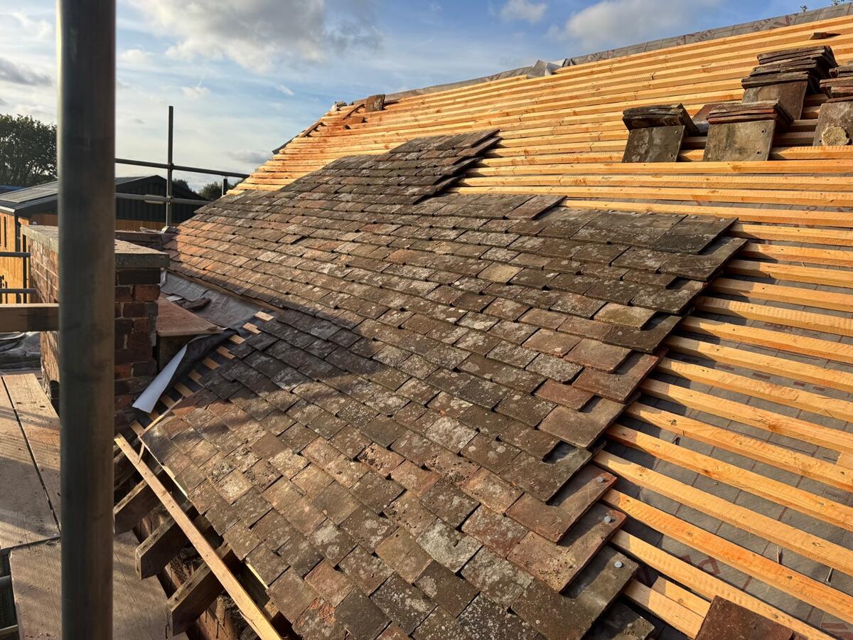 Reclaimed clay tiles on new battens