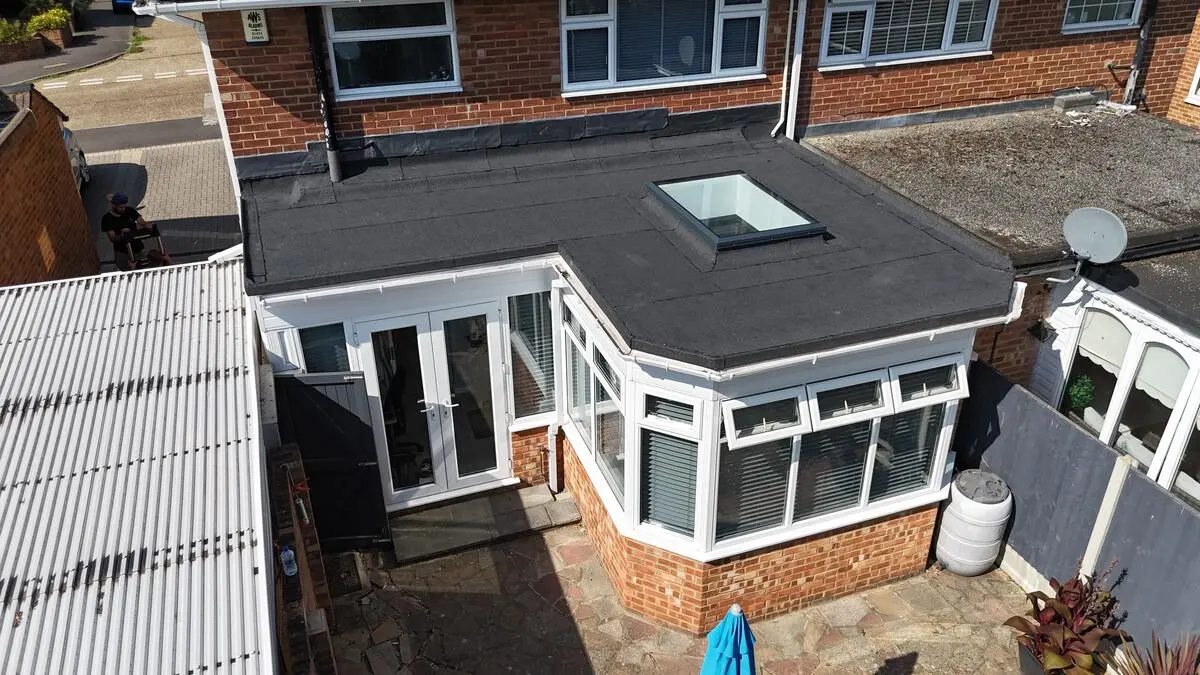 Completed torch-on flat roof extension with skylight