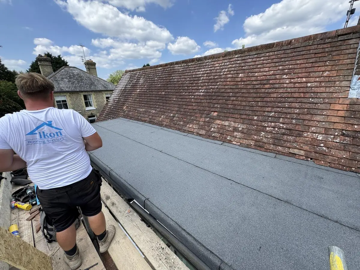 Ikon Roofing team torch-on flat roofing with gas torch