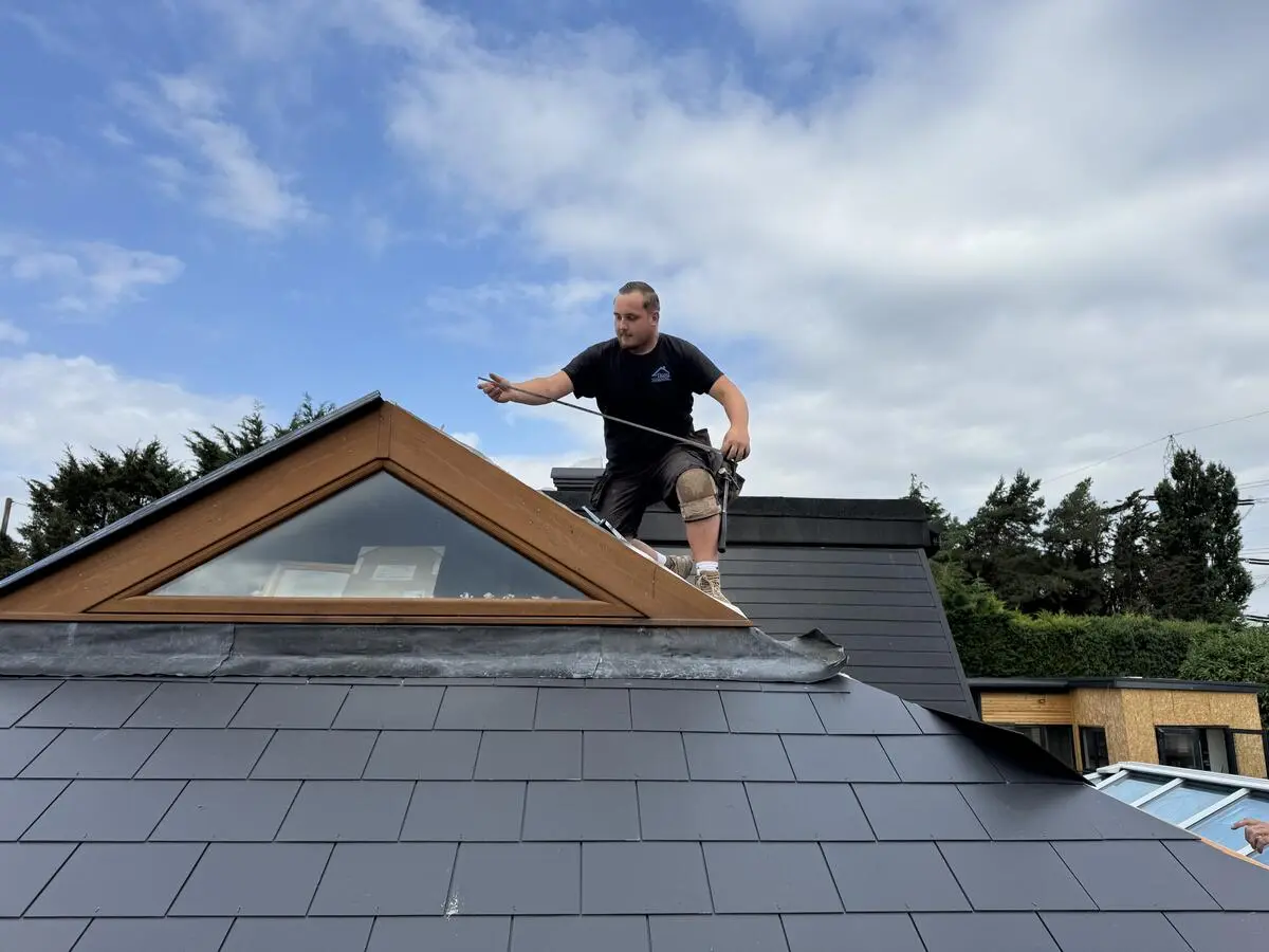 Jordan on slate roof with triangular dormer window