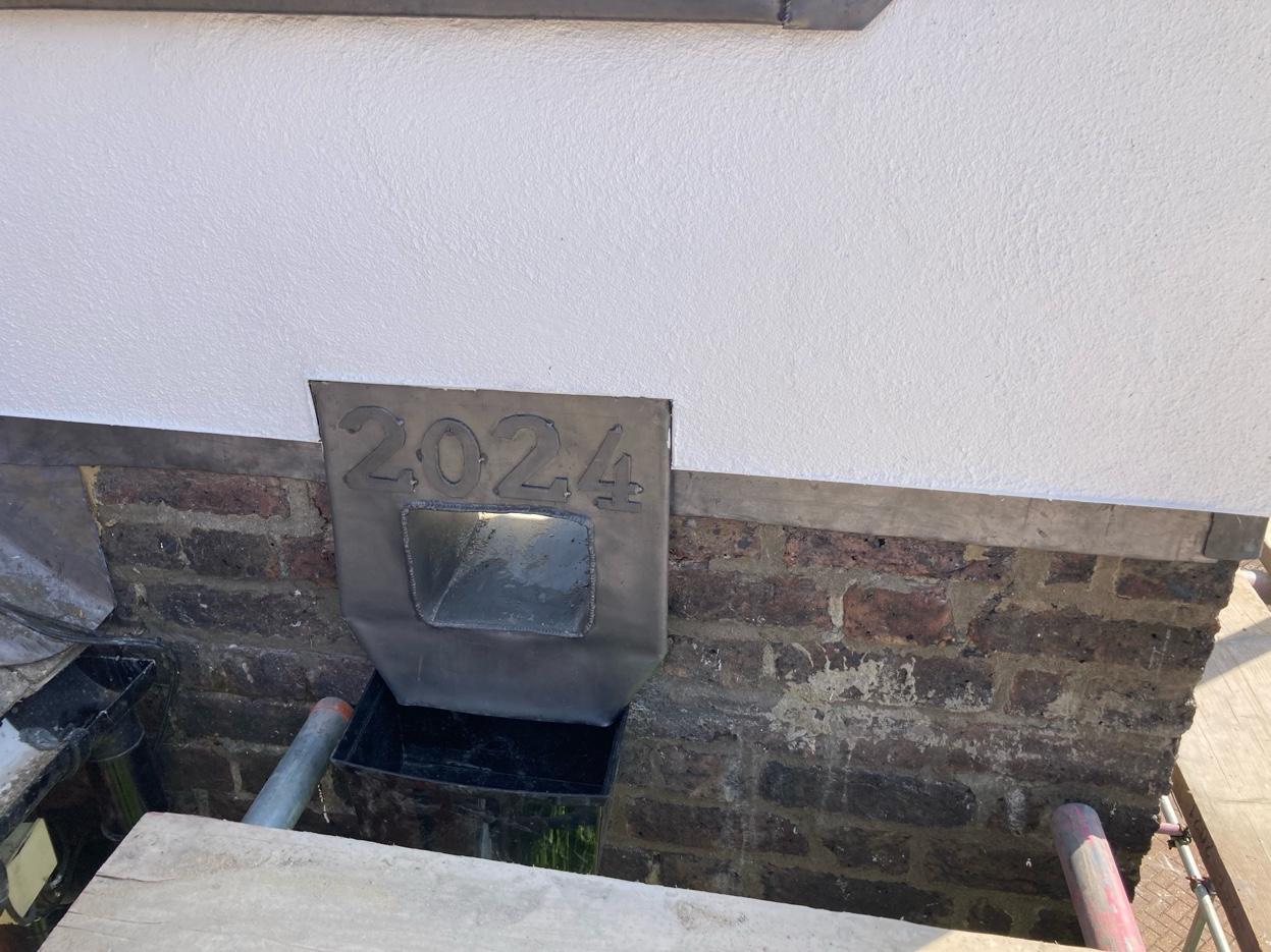 Lead hopper head with 2024 date stamp