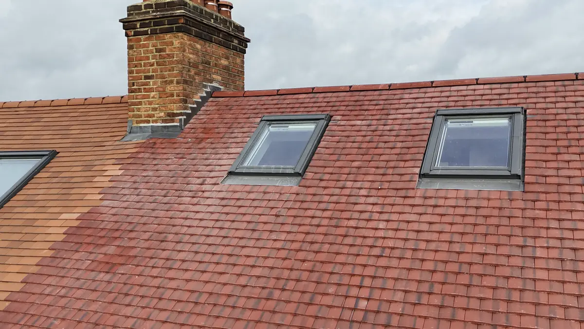 Completed plain tile roof with three Velux windowsDrone view of slate roof with multiple Velux windows installed