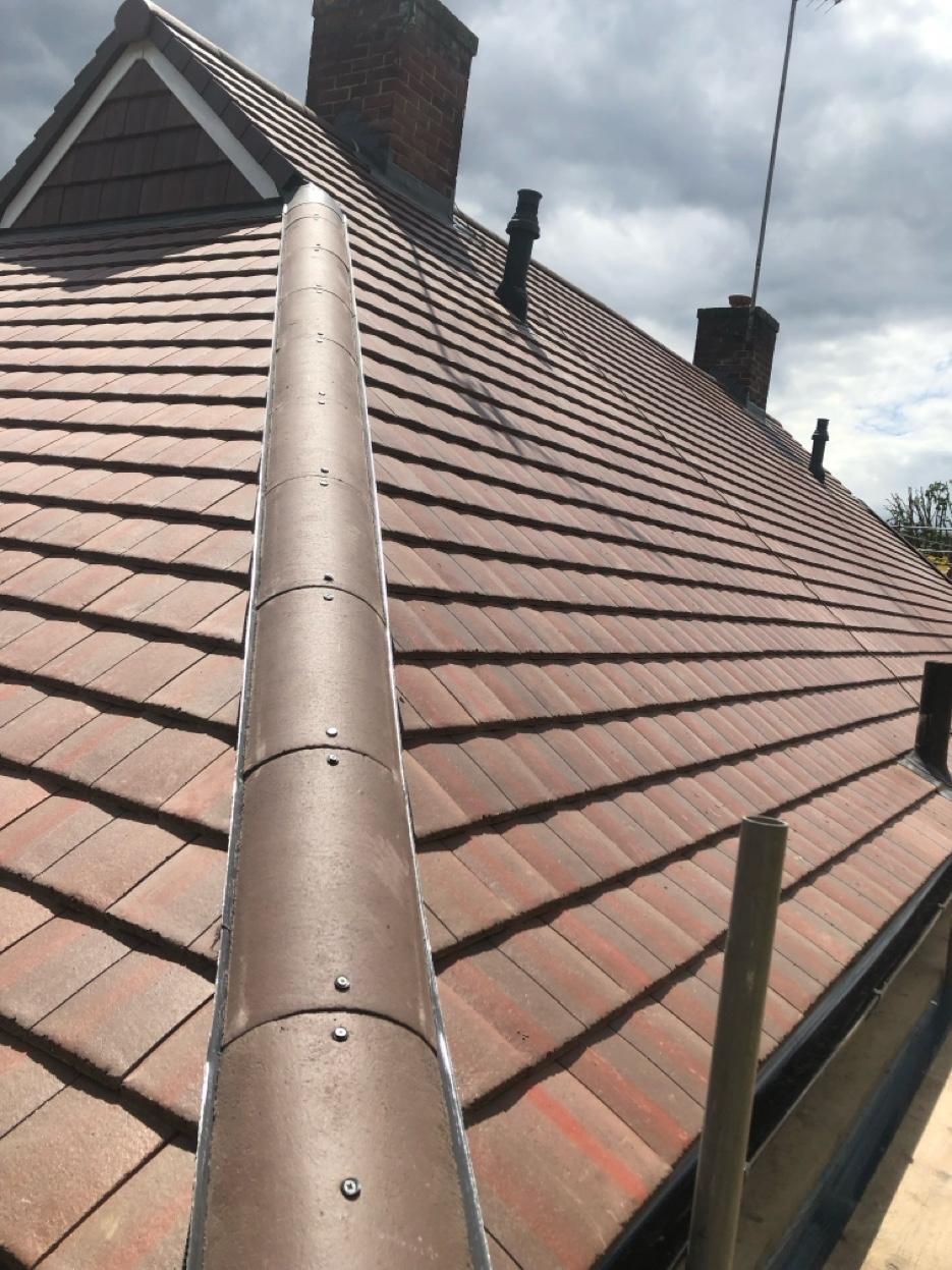 Completed tile re-roof with dry ridge by Ikon Roofing