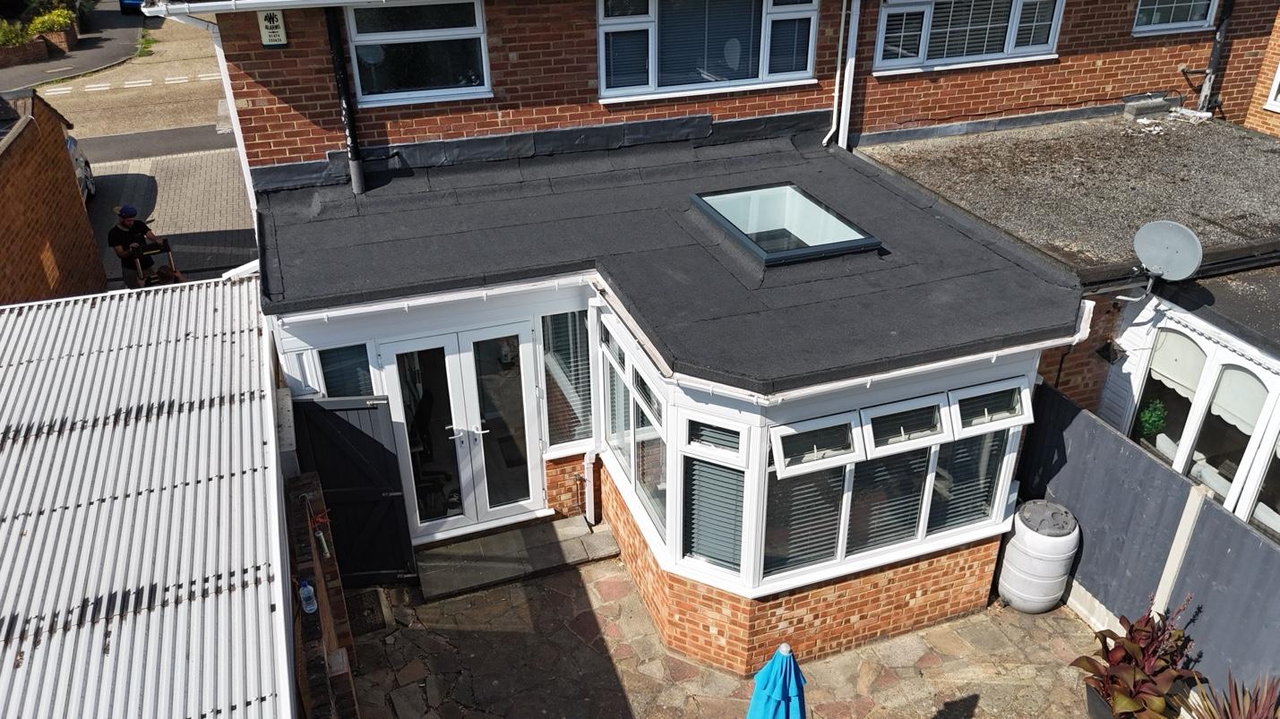 Flat roof extension with skylight — drone view