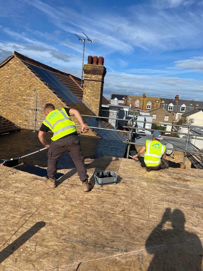 Chimney needing repair with crumbling flaunching