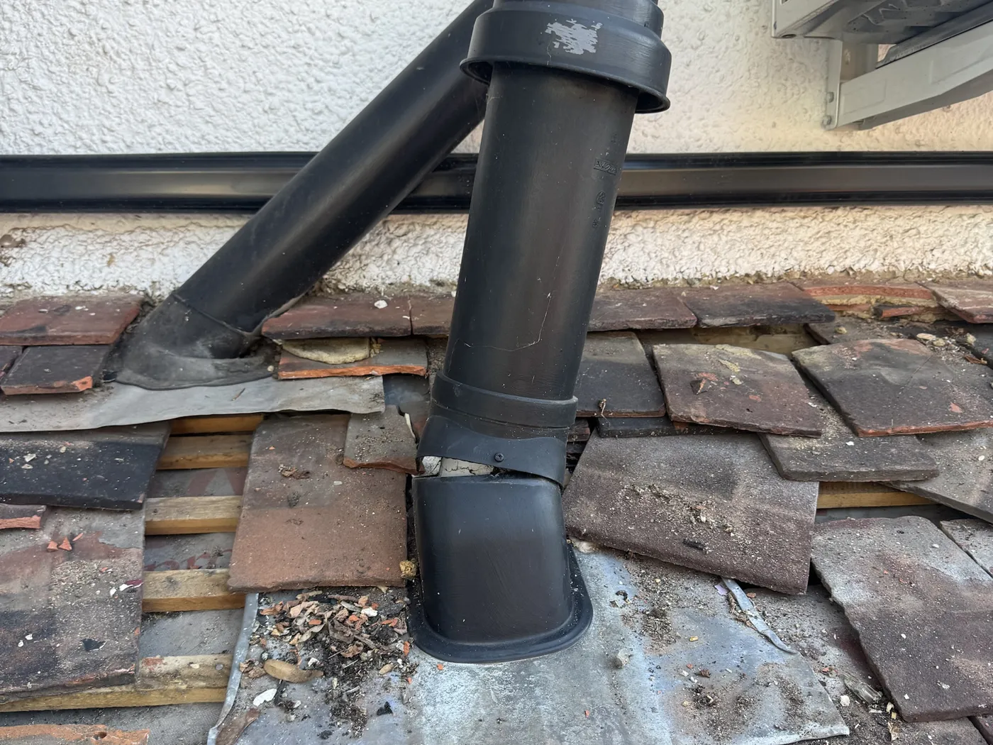 Soil vent pipe re-sealed with a new lead slate during an emergency leak repair